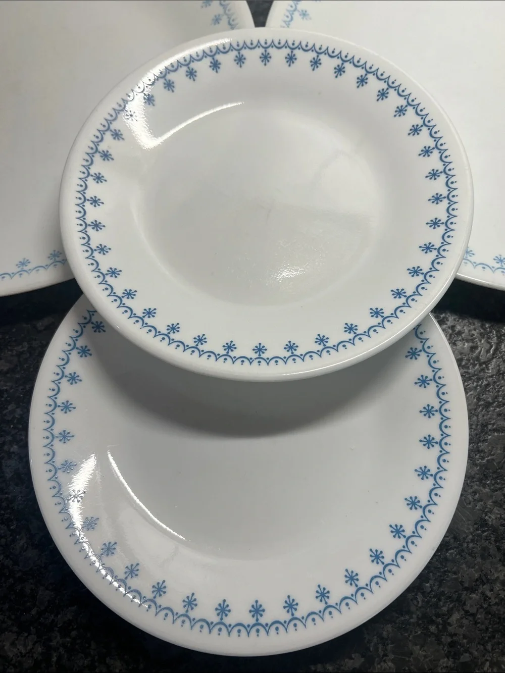 4 piece set of Corelle Dinner plates and salad plates. Snowflake Blue